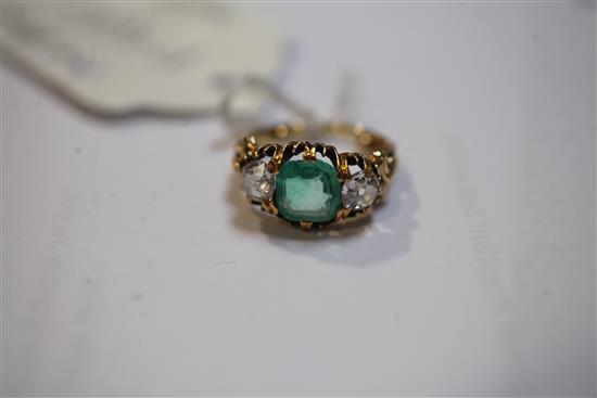 A late Victorian emerald and diamond three stone ring, size I/J